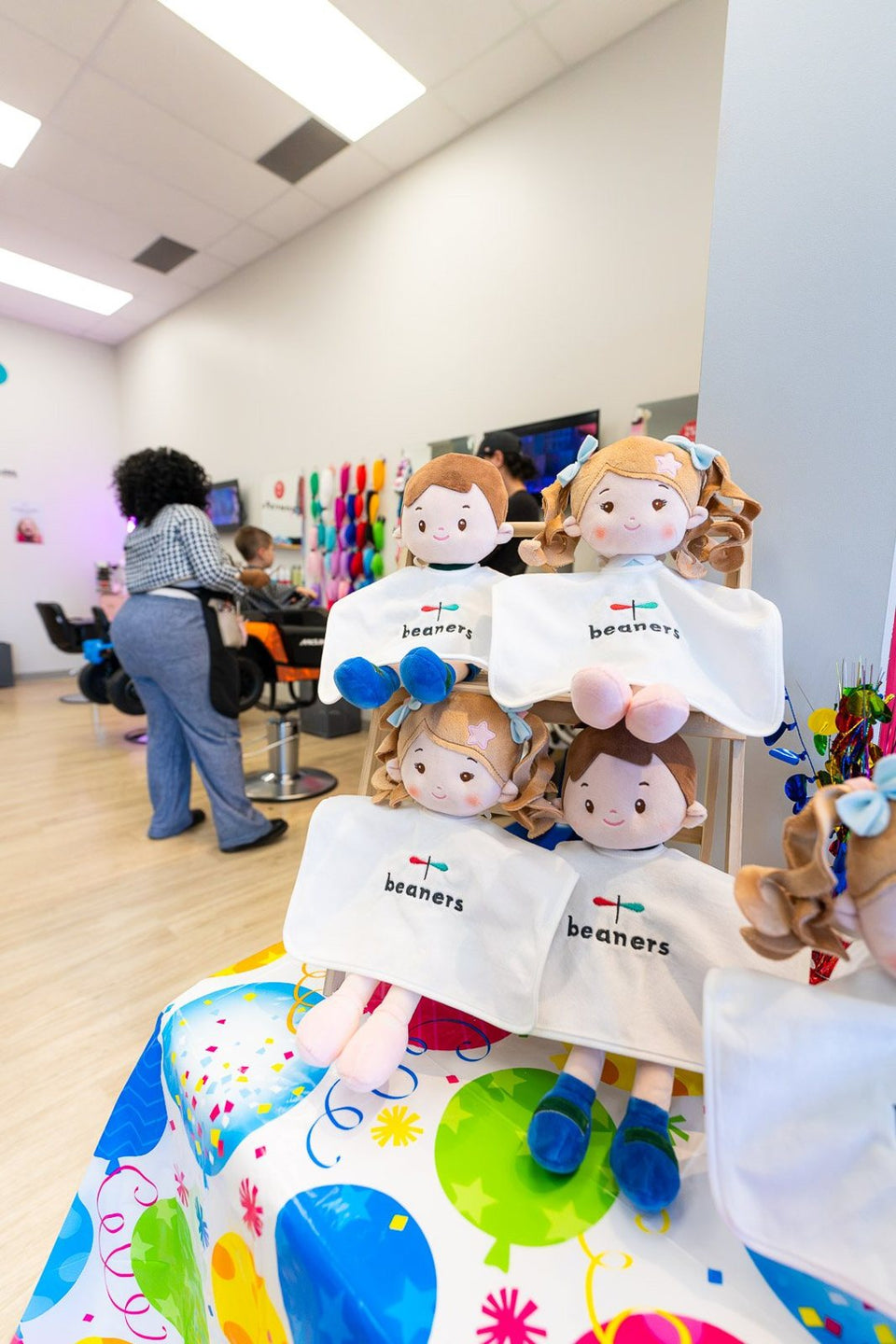 Co-branded dolls on display inside the Beaners salon