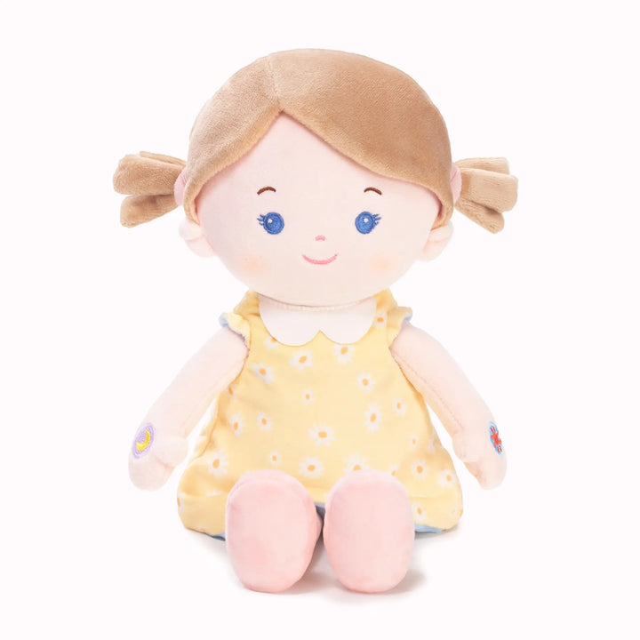 Sophie soft talking doll in free extra yellow floral reversible outfit, seated front view
