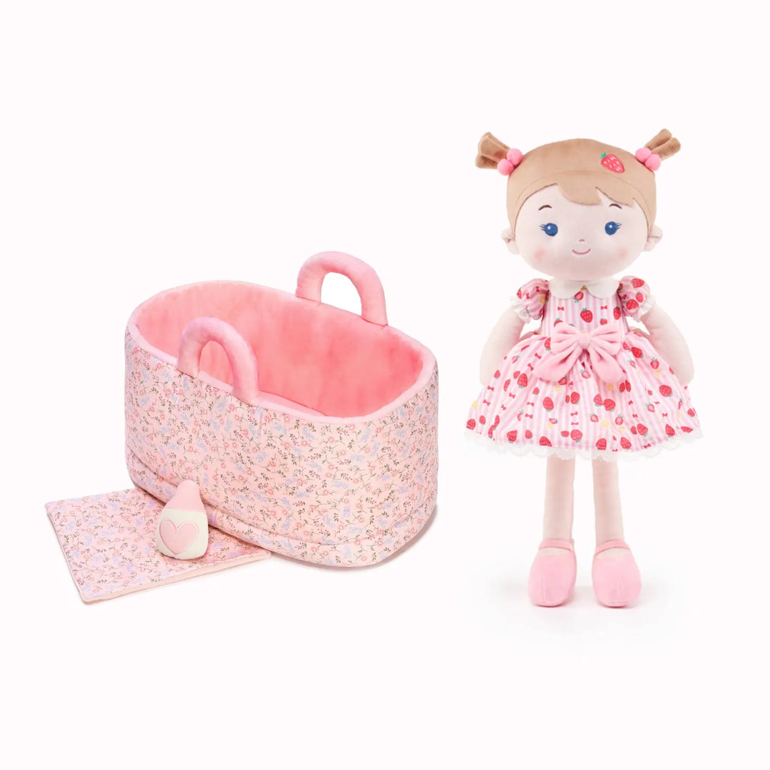 Strawberry Girl plush doll with 13-inch Caregiver Playset including bassinet, blanket, and milk bottle