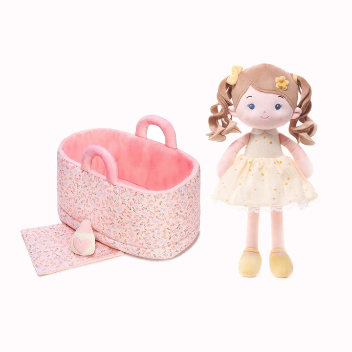 Daisy Girl plush doll with 13-inch Caregiver Playset including bassinet, blanket, and milk bottle